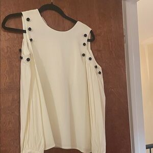 Elegant Cream Sleeveless Top with Black Button Accents